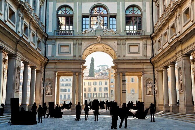 Florence by Night Guided Walking Tour:Duomo Old Bridge & All Must-See Highlights - Ponte Vecchio at night: Vasari Corridor, botteghe, and hill views