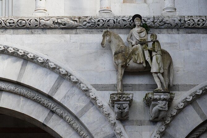 Lucca: Walking tour to discover the city of 100 churches - Starting at Piazza Anfiteatro: Roman shape, photo-friendly mood